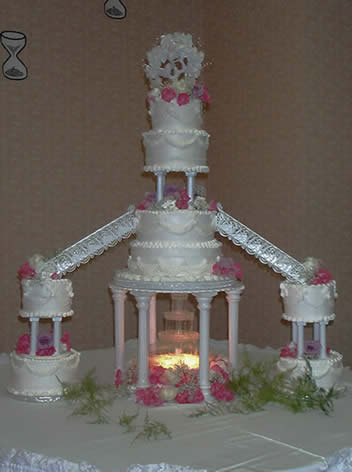 4 tier with satellite cakes, fountain, and seperations